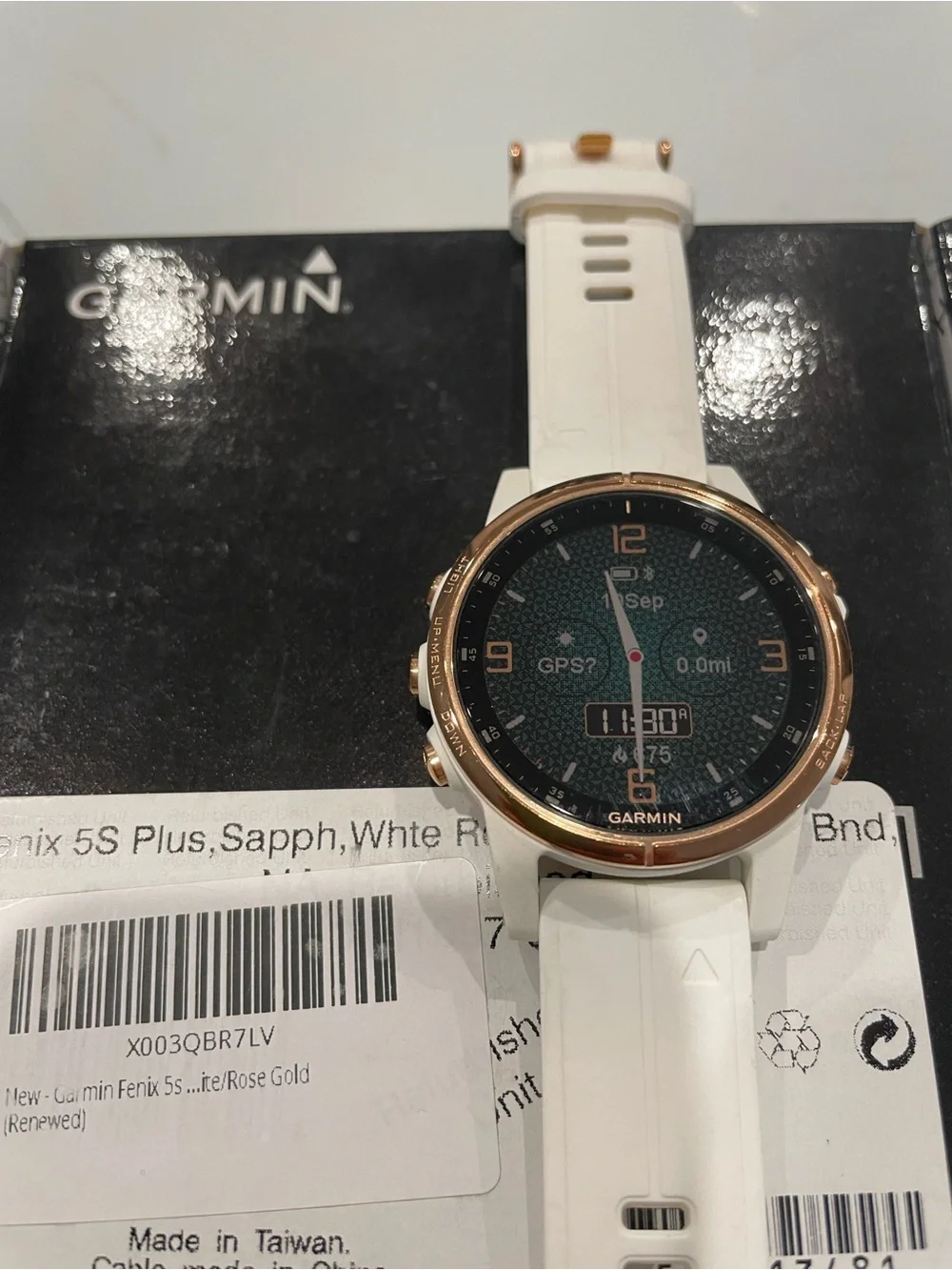 Garmin Fenix 5s Plus smartwatch in white with rose gold bezel